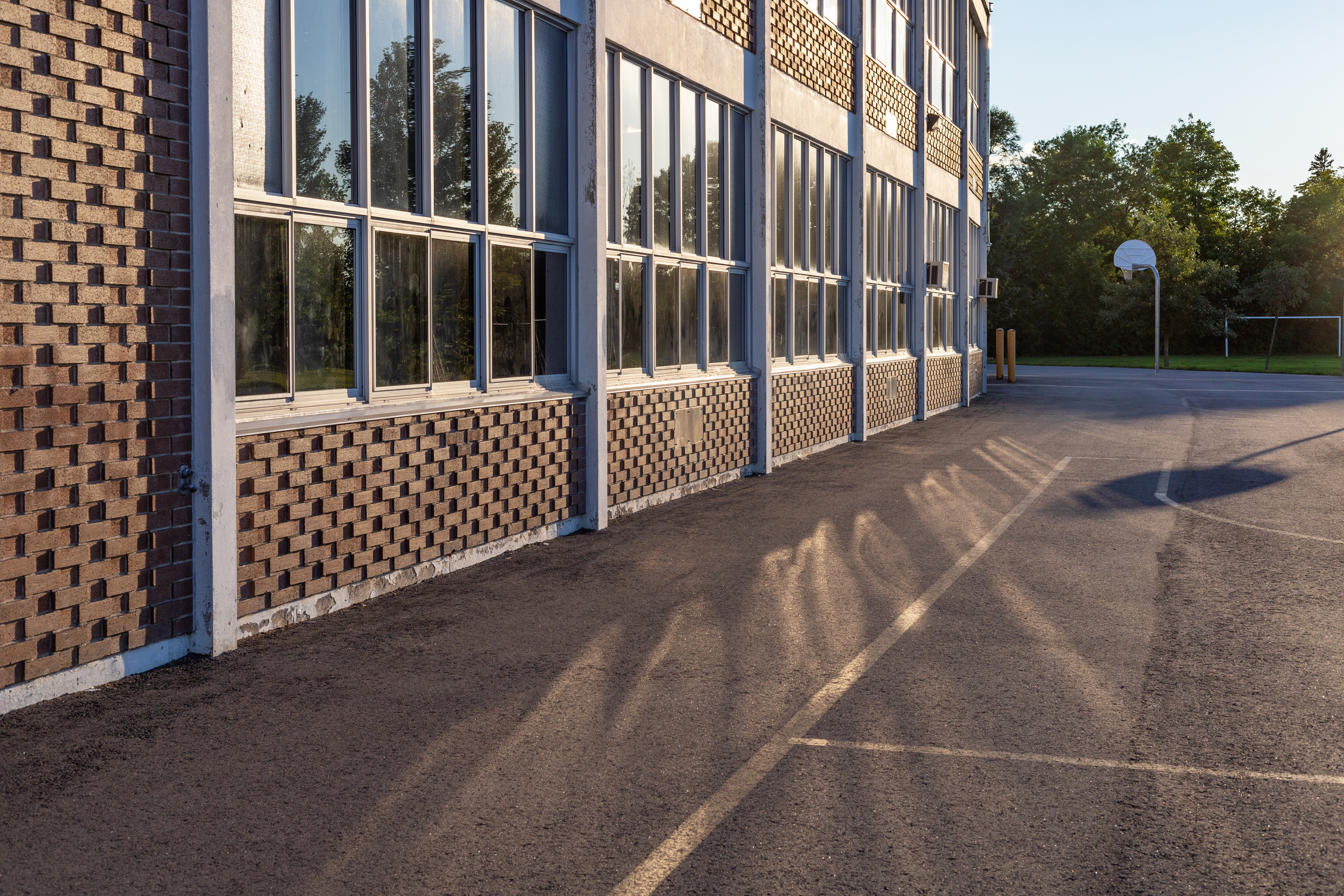 School building and school yard in the evening